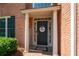 Elegant front entrance with decorative columns and a charming 'Bless This Home' wreath at 3225 Warren Creek Sw Dr, Hiram, GA 30141
