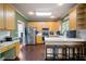 Well-lit kitchen with wood cabinets, stainless steel appliances, and a breakfast bar at 3225 Warren Creek Sw Dr, Hiram, GA 30141