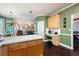 Open kitchen with hardwood floors and stainless appliances adjoining a casual dining area at 3225 Warren Creek Sw Dr, Hiram, GA 30141