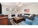 Cozy living room with a marble fireplace, comfortable seating, and natural light at 3225 Warren Creek Sw Dr, Hiram, GA 30141