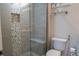 Modern bathroom with tiled shower, built-in seat, and stylish toilet at 4125 Hidden River Dr, Cumming, GA 30028