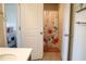 Bathroom includes a bathtub and shower with a decorative floral shower curtain at 4125 Hidden River Dr, Cumming, GA 30028