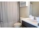 Bathroom with a white shower curtain, toilet, and dark wood vanity with a white countertop and sink at 4125 Hidden River Dr, Cumming, GA 30028