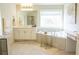 Bright bathroom showcases a soaking tub and large vanity at 4125 Hidden River Dr, Cumming, GA 30028