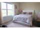 Bright bedroom featuring a full size bed with comfortable pillows and carpeted floor at 4125 Hidden River Dr, Cumming, GA 30028