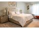Bedroom featuring plush carpeting, a neutral color palette and a modern, upholstered bed at 4125 Hidden River Dr, Cumming, GA 30028