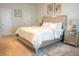 Bedroom featuring plush carpeting, a neutral color palette and a modern, upholstered bed at 4125 Hidden River Dr, Cumming, GA 30028