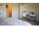 Cozy bedroom with a view of the upstairs hallway and a desk with purple chair at 4125 Hidden River Dr, Cumming, GA 30028