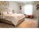 Bedroom featuring plush carpeting, a neutral color palette and a modern, upholstered bed at 4125 Hidden River Dr, Cumming, GA 30028