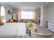 This primary bedroom has a cozy seating area with fireplace at 4125 Hidden River Dr, Cumming, GA 30028