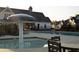 Enjoy the community pool area with mushroom water feature and outdoor seating at 4125 Hidden River Dr, Cumming, GA 30028