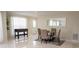 Bright dining area with seating for four and a stylish foosball table for entertainment at 4125 Hidden River Dr, Cumming, GA 30028