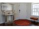 Elegant foyer with a decorative mirror, stylish console table, a round rug, and lots of natural light at 4125 Hidden River Dr, Cumming, GA 30028