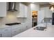 Kitchen featuring stainless steel appliances, white cabinets, and access to the pantry at 4125 Hidden River Dr, Cumming, GA 30028