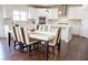 Well-lit kitchen and dining area with modern appliances and hardwood floors at 4125 Hidden River Dr, Cumming, GA 30028