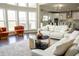 Open-concept living space featuring a modern sofa and bright natural light at 4125 Hidden River Dr, Cumming, GA 30028