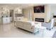 Spacious living room featuring a tiled fireplace, large screen TV, and open layout with sleek, modern decor at 4125 Hidden River Dr, Cumming, GA 30028