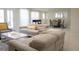 Open-concept living area with comfortable seating, views of the dining area, and doors to an outdoor space at 4125 Hidden River Dr, Cumming, GA 30028