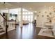 Open-concept living and dining area with large windows providing natural light at 4125 Hidden River Dr, Cumming, GA 30028