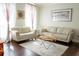 Cozy living room with leather sofas, decorative pillows, and a plush rug, creating a relaxing atmosphere at 4125 Hidden River Dr, Cumming, GA 30028