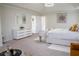 Spacious main bedroom with soft carpet, closet, seating area, and natural light at 4125 Hidden River Dr, Cumming, GA 30028