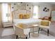 Elegantly staged main bedroom featuring seating area and soft color palette at 4125 Hidden River Dr, Cumming, GA 30028