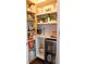 Bright walk-in pantry offers plenty of shelf space and a small wine refrigerator at 4125 Hidden River Dr, Cumming, GA 30028