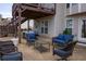 Spacious patio with ping pong table and outdoor seating area under a raised deck at 4125 Hidden River Dr, Cumming, GA 30028