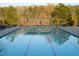 Large community swimming pool perfect for swimming laps with shaded pergola on perimeter at 4125 Hidden River Dr, Cumming, GA 30028
