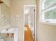 Bathroom features a sink and mirror with view to second room at 112 Bernice Dr, Lawrenceville, GA 30045