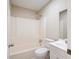 Bathroom features a shower-tub combination, toilet and sink with storage at 112 Bernice Dr, Lawrenceville, GA 30045
