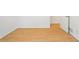 Hardwood floor bedroom featuring white trim and door at 112 Bernice Dr, Lawrenceville, GA 30045