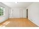 Spacious bedroom with hardwood floors and natural light, offering a serene retreat at 112 Bernice Dr, Lawrenceville, GA 30045