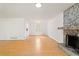 Bright living room with hardwood floors, an attractive stone fireplace and lots of room for entertaining at 112 Bernice Dr, Lawrenceville, GA 30045