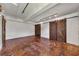 Spacious basement with concrete floors, white walls, exposed ceiling, and sliding barn doors at 172 Haynes Sw St # 108, Atlanta, GA 30313