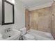 Well-lit bathroom features a shower-tub combo with tile surround and large vanity mirror at 172 Haynes Sw St # 108, Atlanta, GA 30313