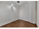 Simple bedroom featuring hardwood floors, white walls, and ample natural light at 172 Haynes Sw St # 108, Atlanta, GA 30313