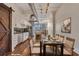 Dining area with a long table next to a well-equipped kitchen at 172 Haynes Sw St # 108, Atlanta, GA 30313