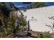 Building exterior featuring a brick wall, greenery, and outdoor seating area at 172 Haynes Sw St # 108, Atlanta, GA 30313