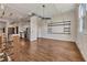 Open-concept living area featuring hardwood floors, exposed ductwork, and a chef's kitchen at 172 Haynes Sw St # 108, Atlanta, GA 30313
