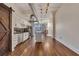 Spacious living room featuring hardwood floors, modern lighting, and a chef-inspired kitchen at 172 Haynes Sw St # 108, Atlanta, GA 30313