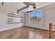 Bright living room features hardwood floors, large windows, and painted brick accent wall at 172 Haynes Sw St # 108, Atlanta, GA 30313