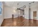 Open living space showcases hardwood flooring, modern lighting, and access to the bathroom at 172 Haynes Sw St # 108, Atlanta, GA 30313