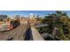 Rooftop deck with wooden floor and stairs to the side, overlooking the city at 172 Haynes Sw St # 108, Atlanta, GA 30313
