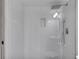 Walk-in shower is fully tiled with a rainfall shower head and built-in shelving at 172 Haynes Sw St # 108, Atlanta, GA 30313