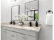 Stylish bathroom with dual sinks, granite countertops, modern fixtures, and natural light at 2318 Plantation Dr, Atlanta, GA 30344