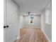 Bedroom featuring a black ceiling fan, hardwood floors, a window, and a closet at 2318 Plantation Dr, Atlanta, GA 30344