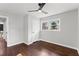 Bright bedroom with hardwood floors, ceiling fan, and natural light from a large window at 2318 Plantation Dr, Atlanta, GA 30344
