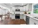 Updated kitchen featuring granite counters, subway tile backsplash, and stainless appliances at 2318 Plantation Dr, Atlanta, GA 30344