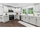 Updated kitchen featuring granite counters, subway tile backsplash, and stainless appliances at 2318 Plantation Dr, Atlanta, GA 30344